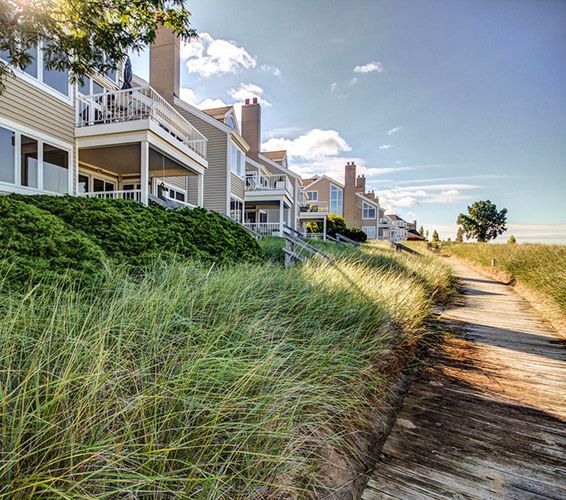 Row of traditional condos with long grass in Holland, Michigan